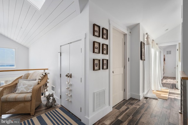 hallway featuring lofted ceiling, wood ceiling, and dark hardwood / wood-style flooring