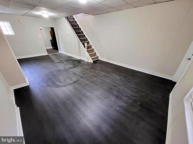 basement featuring a paneled ceiling