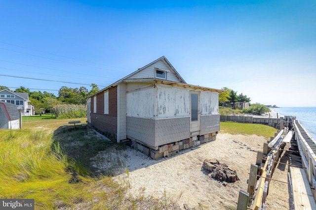 view of outbuilding with a water view