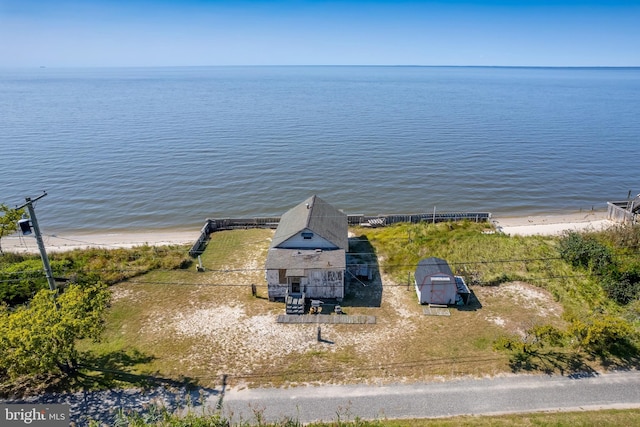 bird's eye view with a view of the beach and a water view