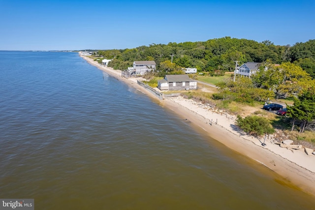 bird's eye view featuring a water view and a beach view