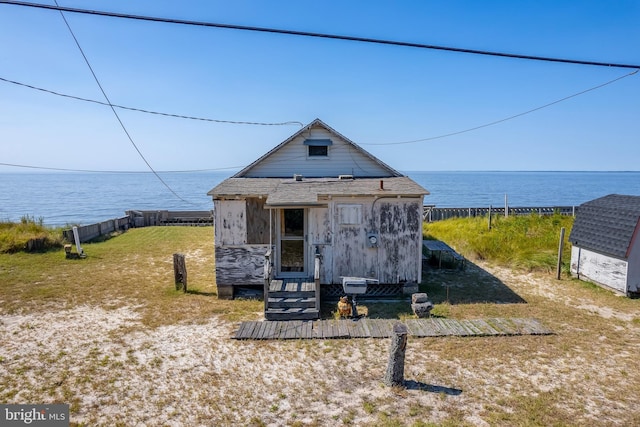 exterior space featuring a water view and a front yard