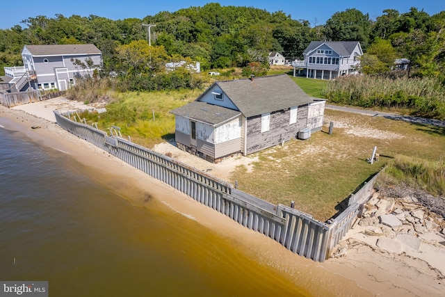 aerial view with a water view and a view of the beach