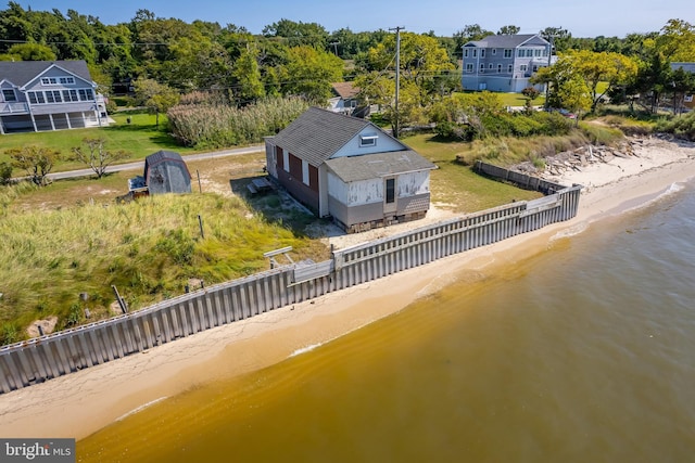 bird's eye view featuring a view of the beach and a water view