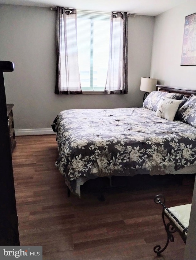 bedroom featuring dark wood-type flooring