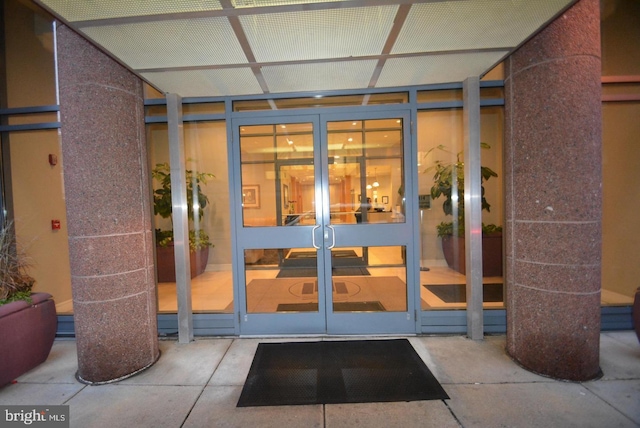 view of exterior entry featuring french doors