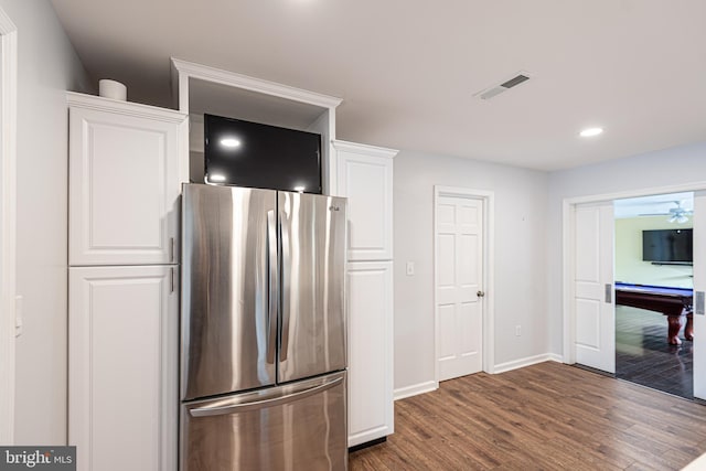 kitchen with dark wood-type flooring, white cabinetry, stainless steel refrigerator, billiards, and ceiling fan