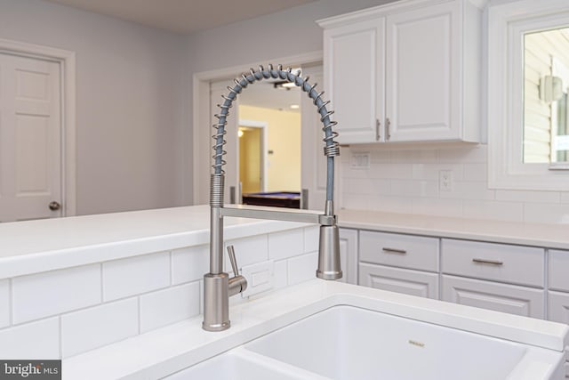 interior space featuring decorative backsplash and vanity