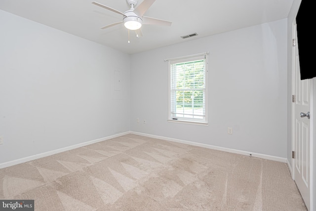 carpeted empty room with ceiling fan