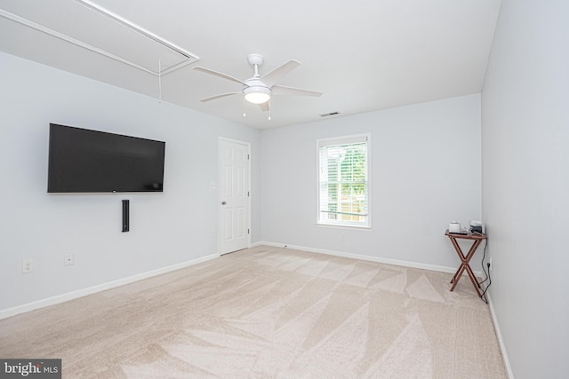 carpeted empty room with ceiling fan