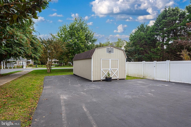 view of outdoor structure with a lawn