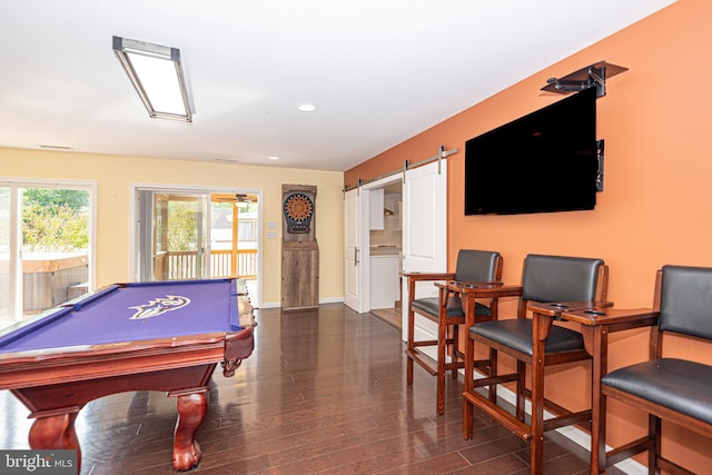 rec room with dark hardwood / wood-style flooring, billiards, and a barn door