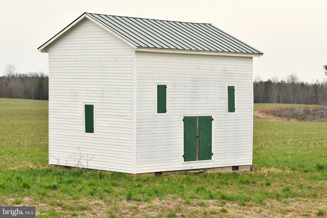 view of property exterior with a yard