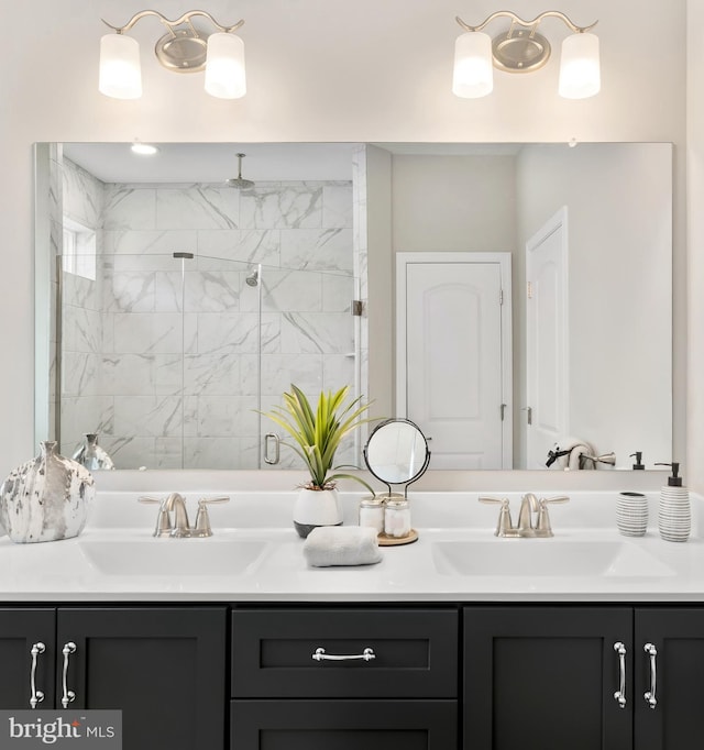 bathroom with vanity and a shower with shower door