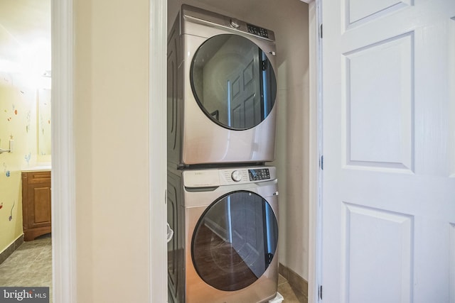 laundry area with stacked washing maching and dryer