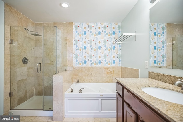 bathroom featuring tile patterned flooring, plus walk in shower, and vanity