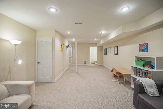 recreation room with light carpet