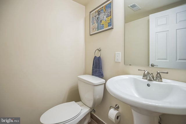 bathroom with sink and toilet