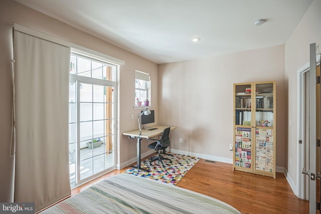 home office featuring hardwood / wood-style flooring