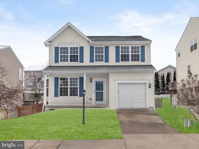 view of property featuring a garage and a front yard