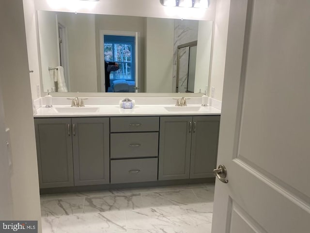 bathroom featuring vanity and a shower with shower door