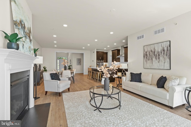 living room with light hardwood / wood-style flooring