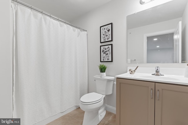 bathroom featuring vanity, toilet, and tile patterned flooring