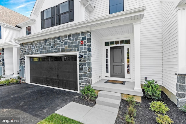 doorway to property featuring a garage