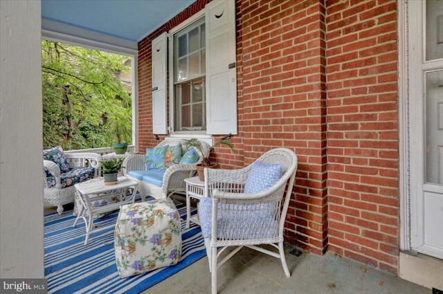 view of patio featuring a porch