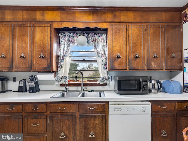 kitchen with sink and white dishwasher