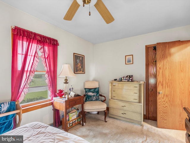 bedroom featuring ceiling fan and light colored carpet