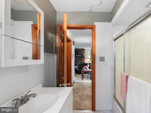 bathroom with vanity and a fireplace