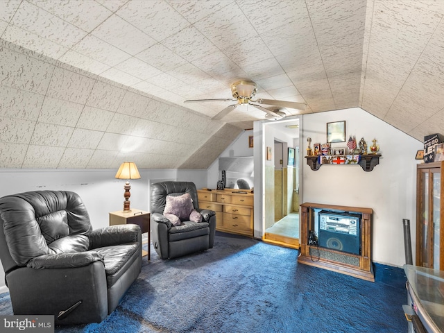 interior space with lofted ceiling, ceiling fan, and carpet flooring