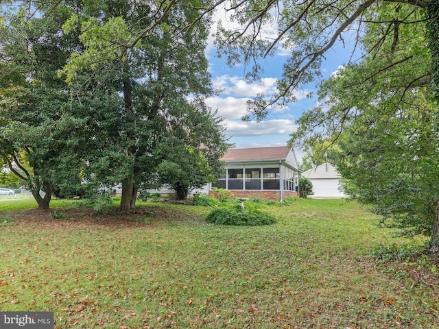 view of yard with a sunroom