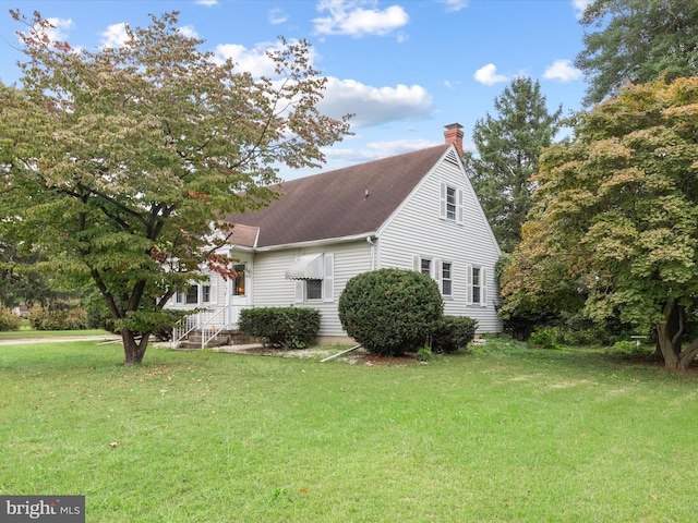 view of home's exterior featuring a yard