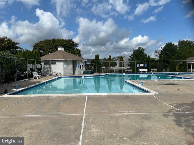 view of swimming pool with a patio area