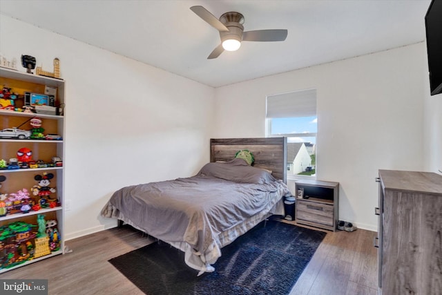 bedroom with hardwood / wood-style flooring and ceiling fan