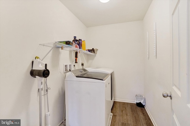 washroom with separate washer and dryer and hardwood / wood-style flooring