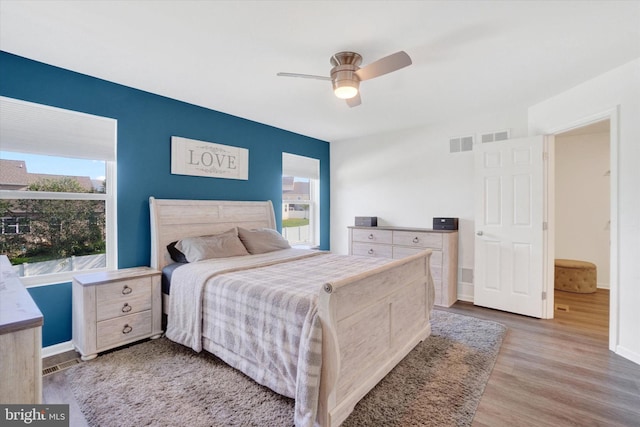 bedroom featuring hardwood / wood-style floors and ceiling fan