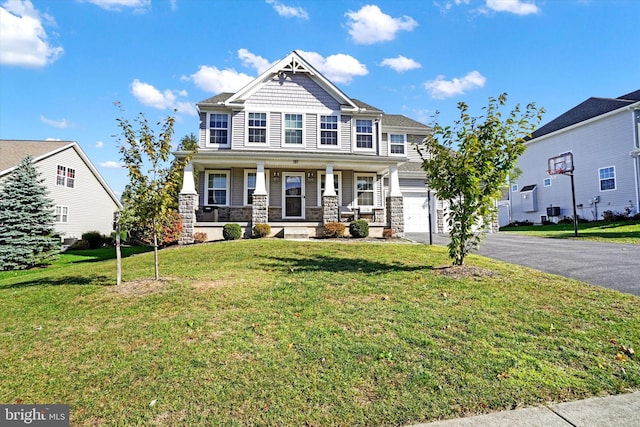 view of front of house featuring a front yard and covered porch