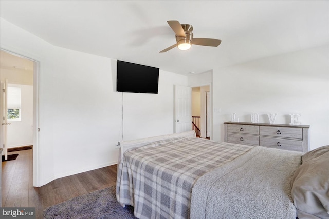 bedroom with dark wood-type flooring and ceiling fan