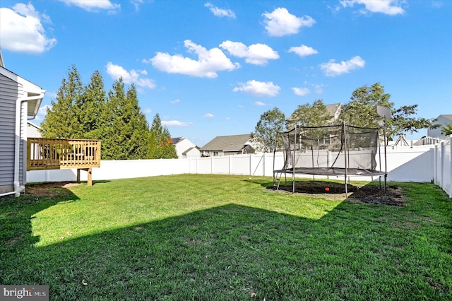 view of yard with a trampoline