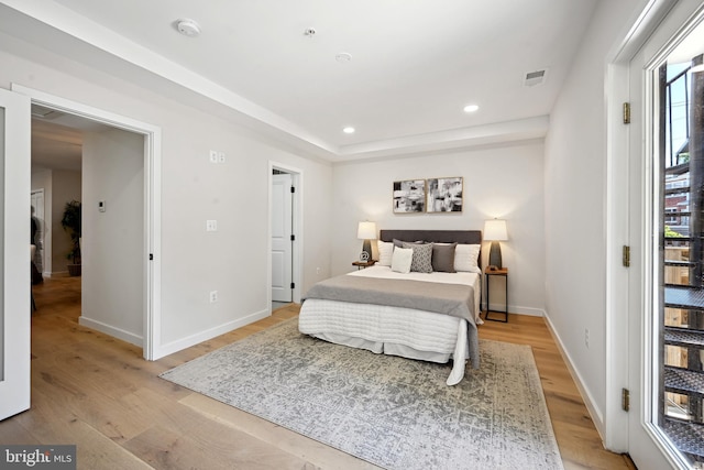 bedroom with light hardwood / wood-style flooring