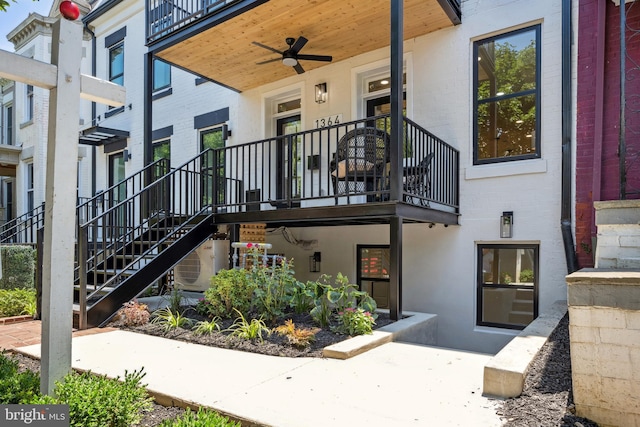 property entrance featuring ceiling fan and a balcony