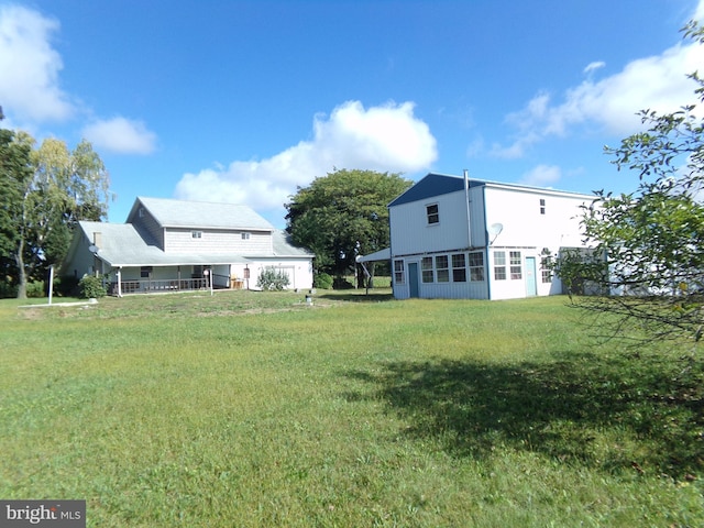 view of yard with a sunroom