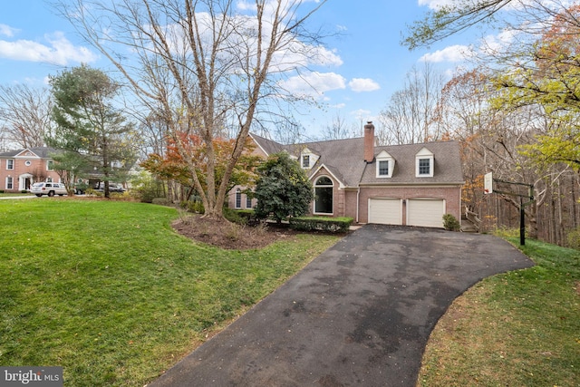 cape cod-style house featuring a garage and a front yard