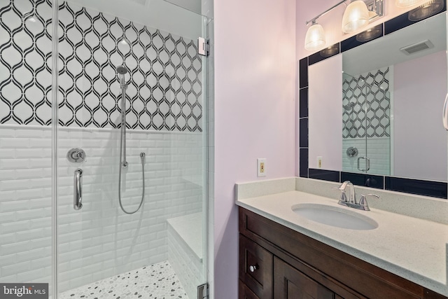 bathroom with vanity and walk in shower