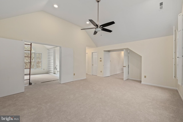 unfurnished living room with light carpet, high vaulted ceiling, and ceiling fan