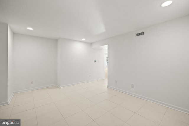 empty room featuring light tile patterned floors