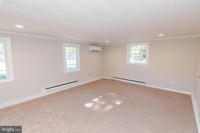 basement with a baseboard radiator, carpet flooring, ornamental molding, and an AC wall unit